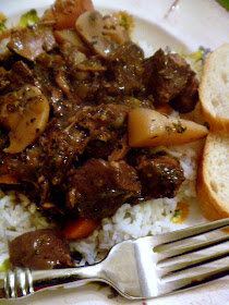 Beef Burgundy Stew:  Tender cuts of beef simmered in red wine along side mushrooms, carrots, and potatoes.  Comfort food Heaven! - Slice of Southern