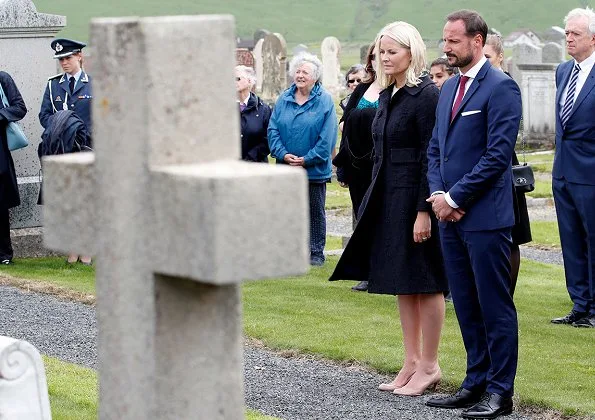 Crown Princess Mette-Marit and Crown Prince Haakon attended St. Magnus festival in Scotland. Prada dress, Christian Louboutin pumps