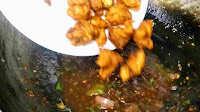 Adding fried chicken in manchurian sauce for chicken manchurian recipe