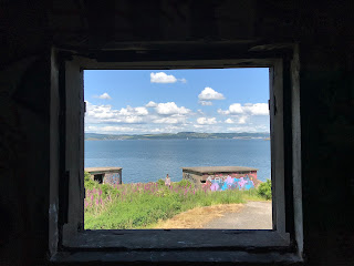 View over the Forth to Fife from the empty concrete window of one of the abandoned WWII buildings on Cramond Island, Edinburgh.  Photo by Kevin Nosferatu for the Skulferatu Project