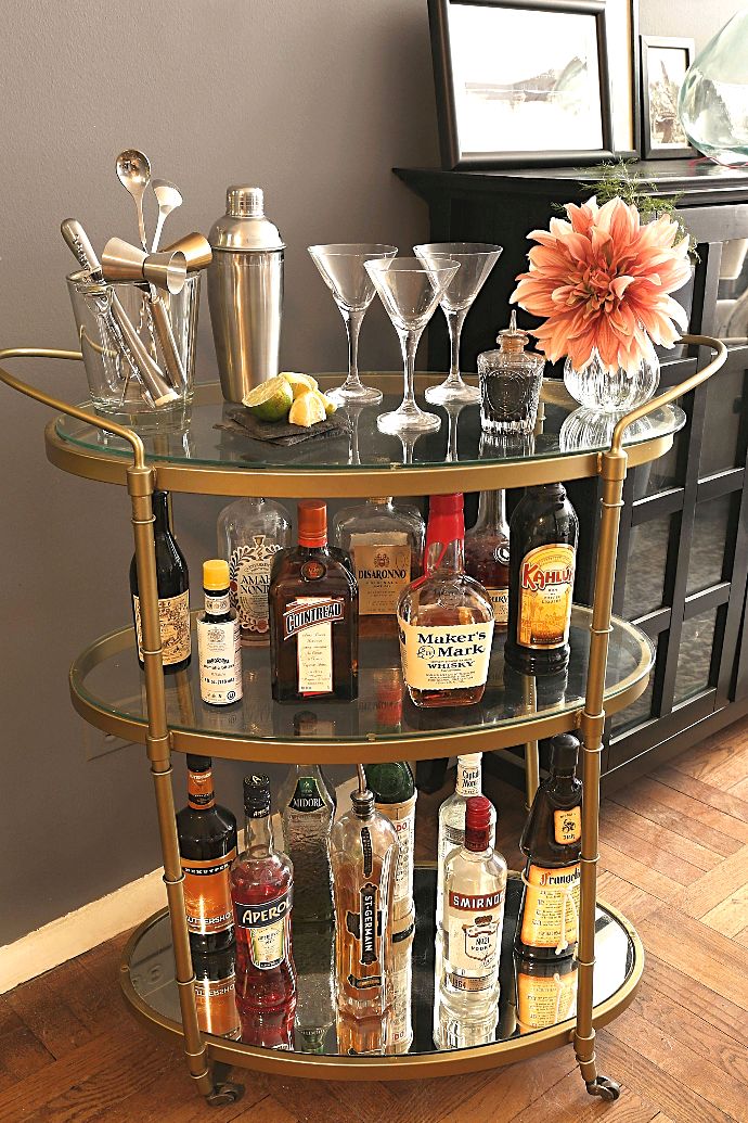 Easy guide for putting together a home bar including spirits, mixers, glassware and tools.