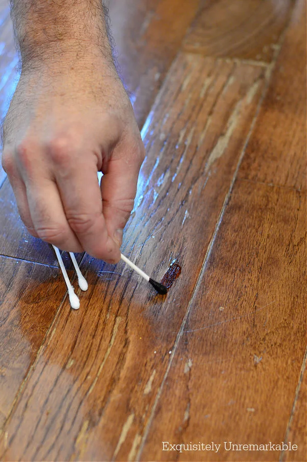 Using Wood Stain To Fix Wood Floor with a q-tip application