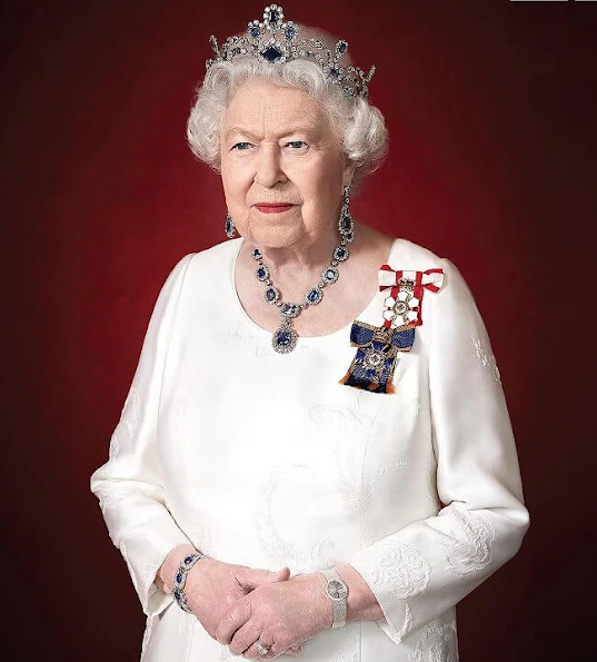 Queen Elizabeth is wearing Sovereign of the Order of Canada and the Order of Military Merit and Modern Sapphire Tiara and George VI Sapphire parure