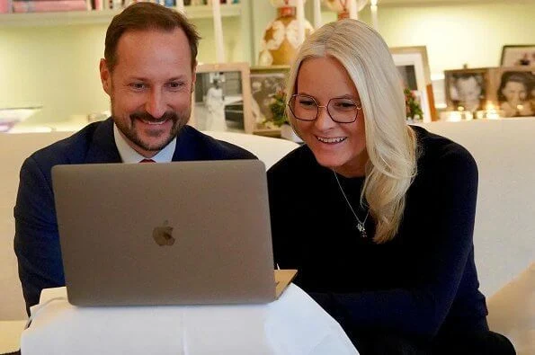 Crown Princess Mette-Marit wore a navy cashmere sweater and navy trousers from by Timo. Bottega Veneta Oxidized zircon earring, and gold necklace