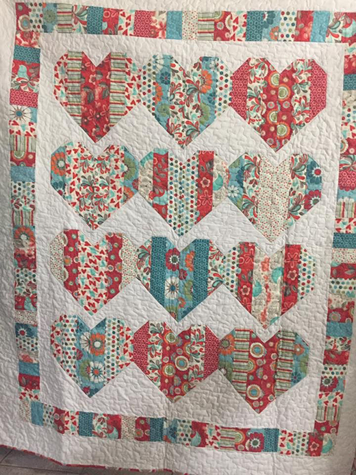 Love Booth Quilt by Kathleen Villarreal, The Pattern designed by Krystal Jakelwicz of Lets Quilt Something 