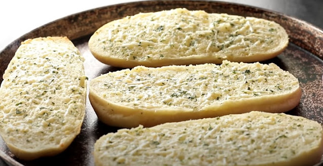 Spread Garlic butter on bread