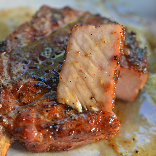 Image of sliced pork chop with brown sugar butter