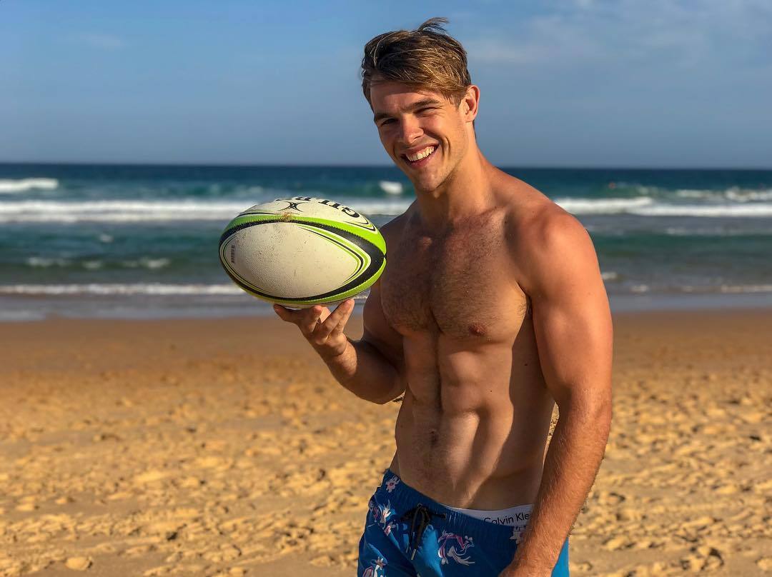 handsome-beefy-beach-jock-smiling
