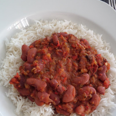 Red Beans and Rice:  A one dish meal of red kidney beans flavored with bacon and peppers served over rice.