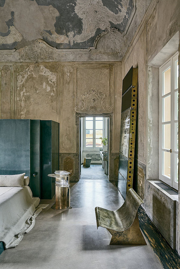 A cast aluminium brass chair by Vincenzo de Cotiis in a private home