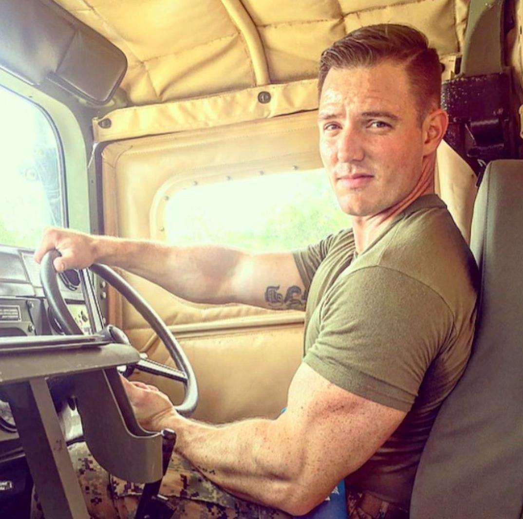 beefy-muscle-soldier-on-duty-driving-military-truck-huge-biceps-bangable-smirk