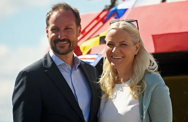 Crown Princess Mette-Marit wore nude eloise flats by Christian Louboutin. Maria La Rosa green clutch. Saint Laurent sunglasses