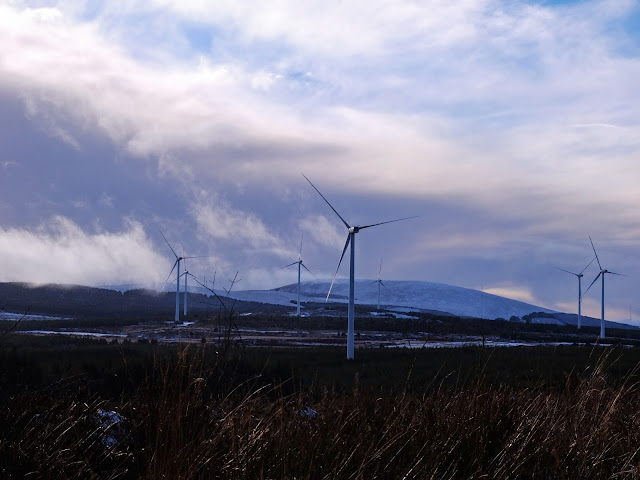 Landscape photo of a windmill farm in the Boggeragh Mountains in Ireland in winter.