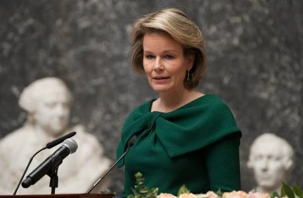 Queen Mathilde wore a green dress by NATAN. Queen Elisabethand Queen Fabiola Honorary Member of Belgian Royal Academy