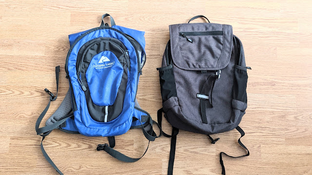 A bird's eye view of the Ozark Trail Hydration Pack beside the Mountain Warehouse laptop backpack.