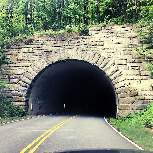 introvert roadtrip cobblestone tunnel