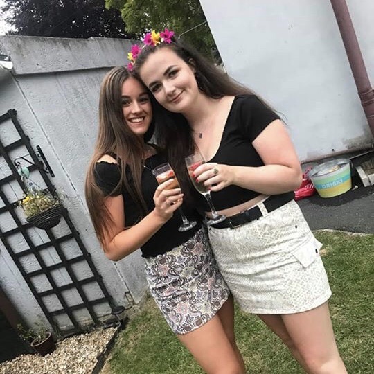 Two friends at a party