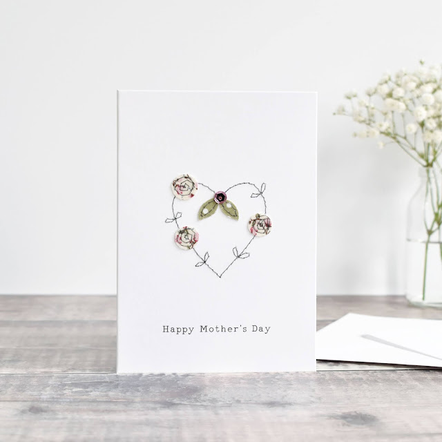 Handmade embroidered Mother's Day card with an  embroidered heart and fabric flowers sewn using freehand machine embroidery. Handmade by Stitch Galore