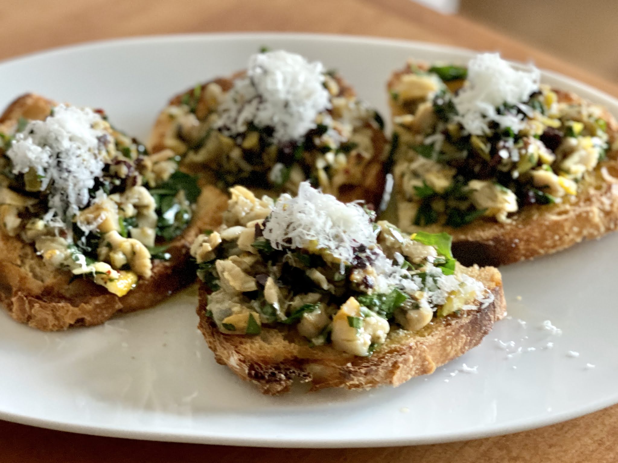 Food Hunter's Guide to Cuisine Clam Toast with Tapenade