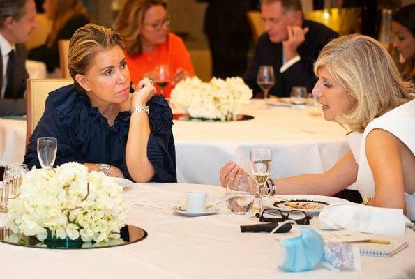 Grand Duchess Maria Teresa wore a navy blue round neck puff sleeve ruffled blouse