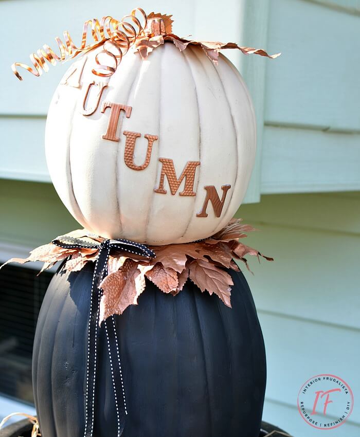 A non-traditional twist for making stacked pumpkin topiaries for fall with painted faux pumpkins and unique copper elements to flank your front door.
