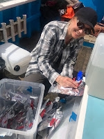 Mel carefully collecting sea water samples for carbon measurements.