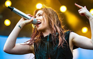 Picture of Chrissy Costanza performing in the stage