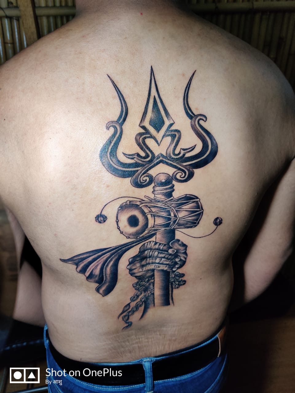 Crazy ink tattoo & Body piercing Surat - SHIVA THEME TATTOO trishul tattoo  with om and damru tattoo design by artist bhumi jain done at crazy ink  tattoo and body piercing TRISHUL