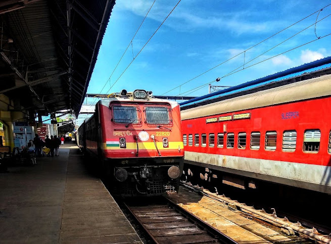 Indian Raliways - A train arriving at a railway station.