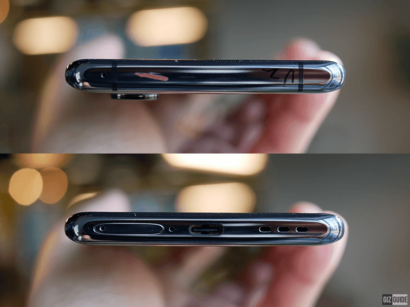 The mic on top, SIM tray slot, another mic, USB-C, and speaker below