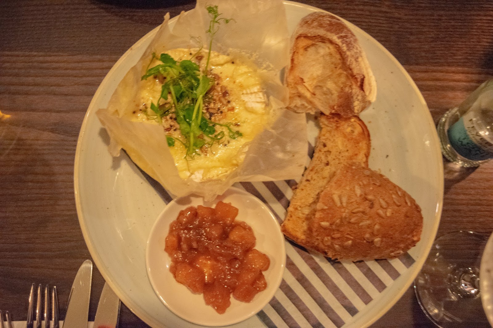 What Cat Says | Country Pub & Dining Experience at The Red Lion, Welwyn A birdseye view of the baked Camembert with four pieces of bread and the fruit chutney on the side.