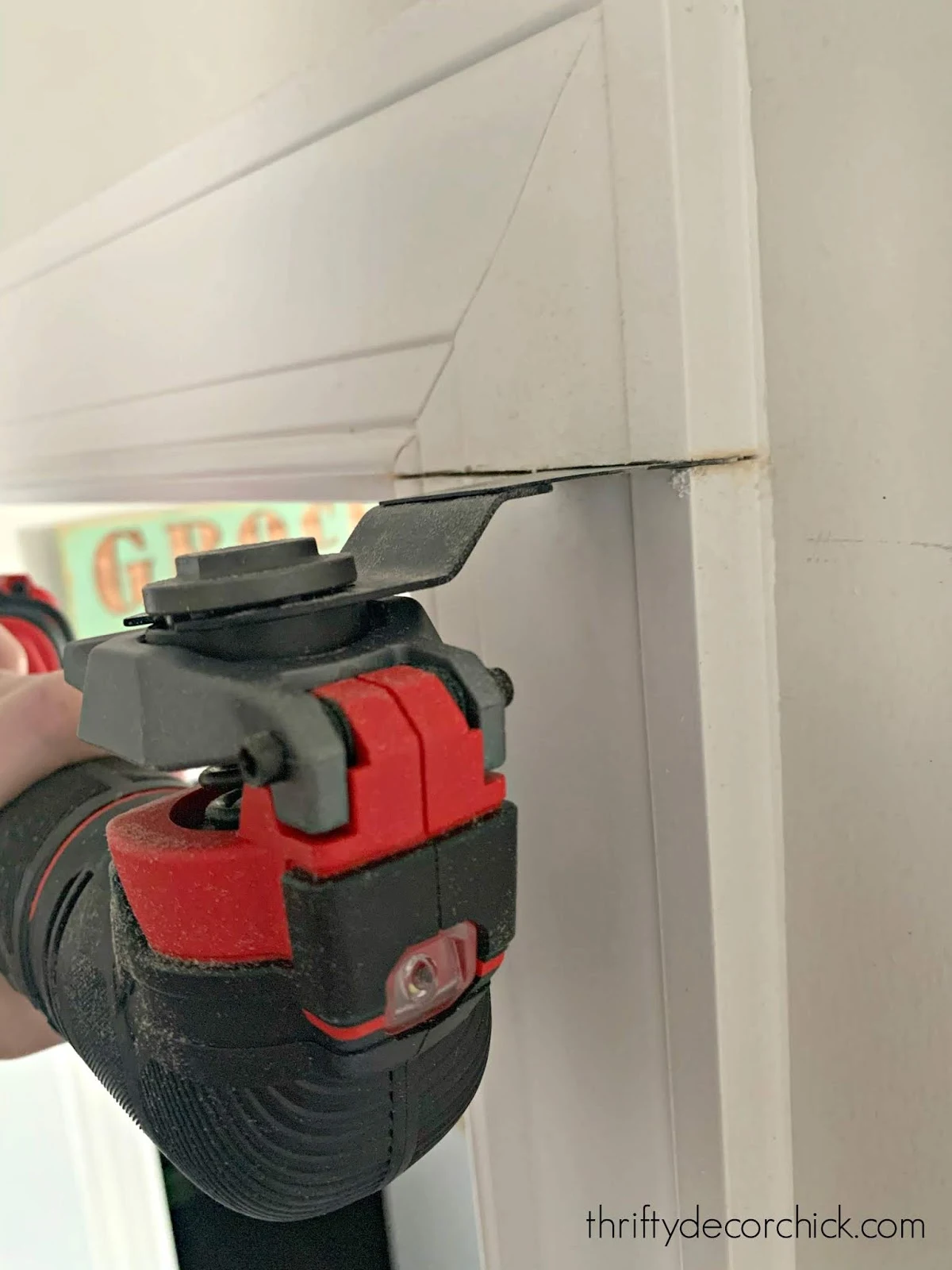 Cutting door trim on the wall 