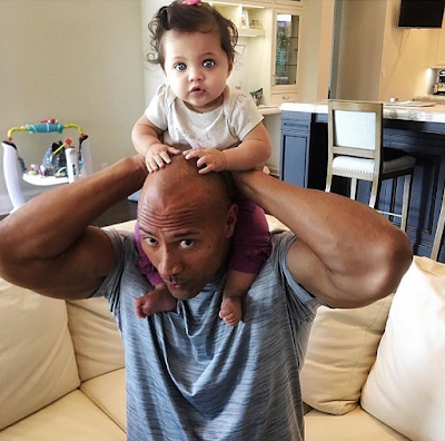 1a3 The Rock shows off his new baby as he celebrates US Labor day