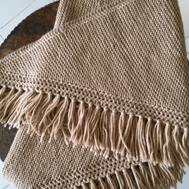 Beige knitted shawl