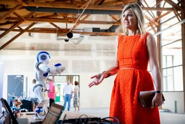 Queen Maxima wore a Natan summer dress in orange. The Queen visited technology facility TechnoHUB in Woerden