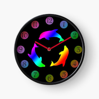 A clock with a rainbow dolphin logo on it