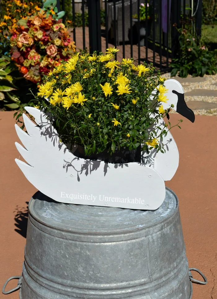 Swan Decoy Planter on a galvanized tub