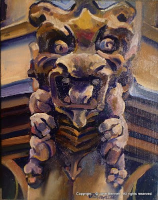 Plein air oil painting of carved yellowblock sandstone gargoyle on the roof of Maclaurin Hall,Sydney University painted by industrial heritage artist Jane Bennett