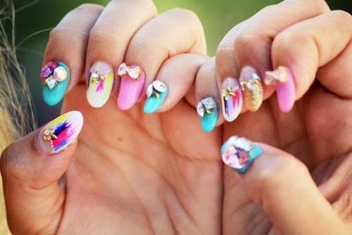 Whimsical colourful nails with bright feather accents