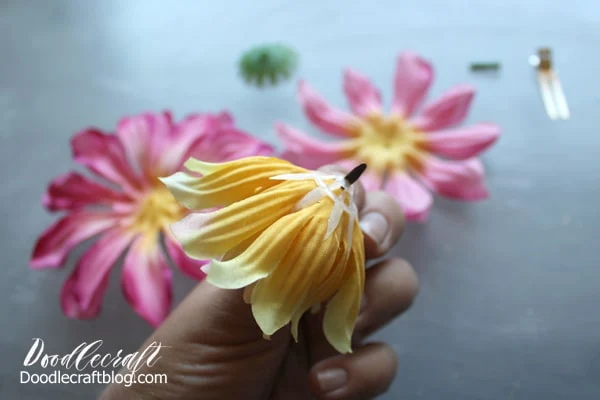 Put the silk flower back together using a brad paper fastener