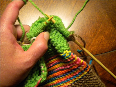 Knit-while-seaming. Your work will be tight at the legs.