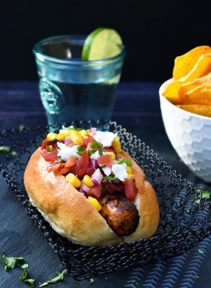 Vegan hot dog Vegan hot dog topped with Mexican salad toppings