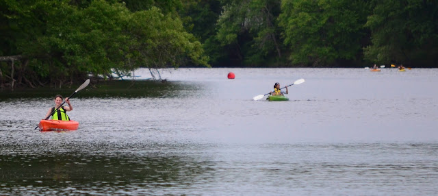 image of students paddling on the Merrimack river in kayaks