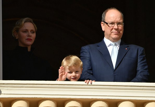 Prince Albert, Princess Charlene and Prince Jacques. Princess Charlene wore a long coat by Akris. gold wedding ring