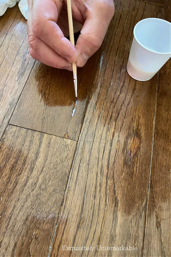 Partner accidentally dropped nail posh remover on wood floor. How do I fix  this? Any suggestions? : r/fixit