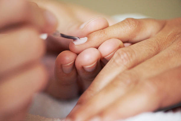 woman getting her short nails done