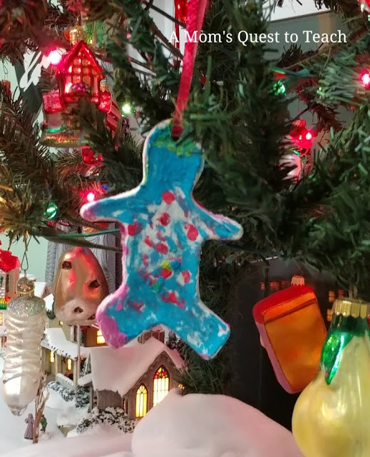 Gingerbread cookie salt dough ornament hanging in Christmas tree