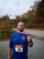 Image:  Lance holding his finisher medal.