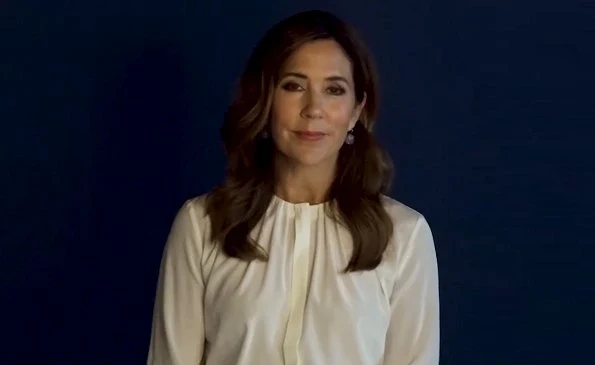 Crown Princess Mary wore a silk blouse from Hugo Boss. Banora8 silk blouse. She is wearing a Dulong Fine Jewelry Anello pearl earrings