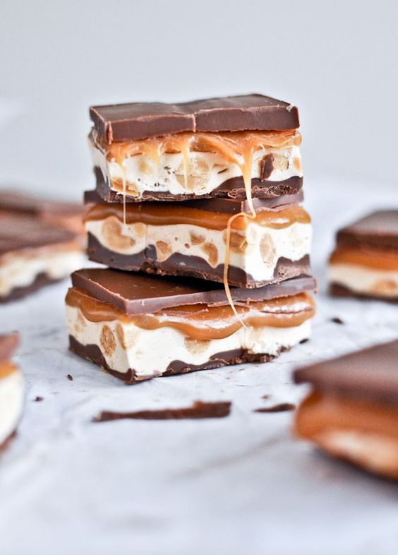 Homemade Snickers Bars makes one 9×13 pan bottom chocolate layer 1 1/4 cups milk chocolate chips 1/4 cup peanut butter Thoroughly grease you baking pan. Melt ingredients together in a saucepan or microwave, then pour into the baking dish and spread until even. Let cool and harden completely.